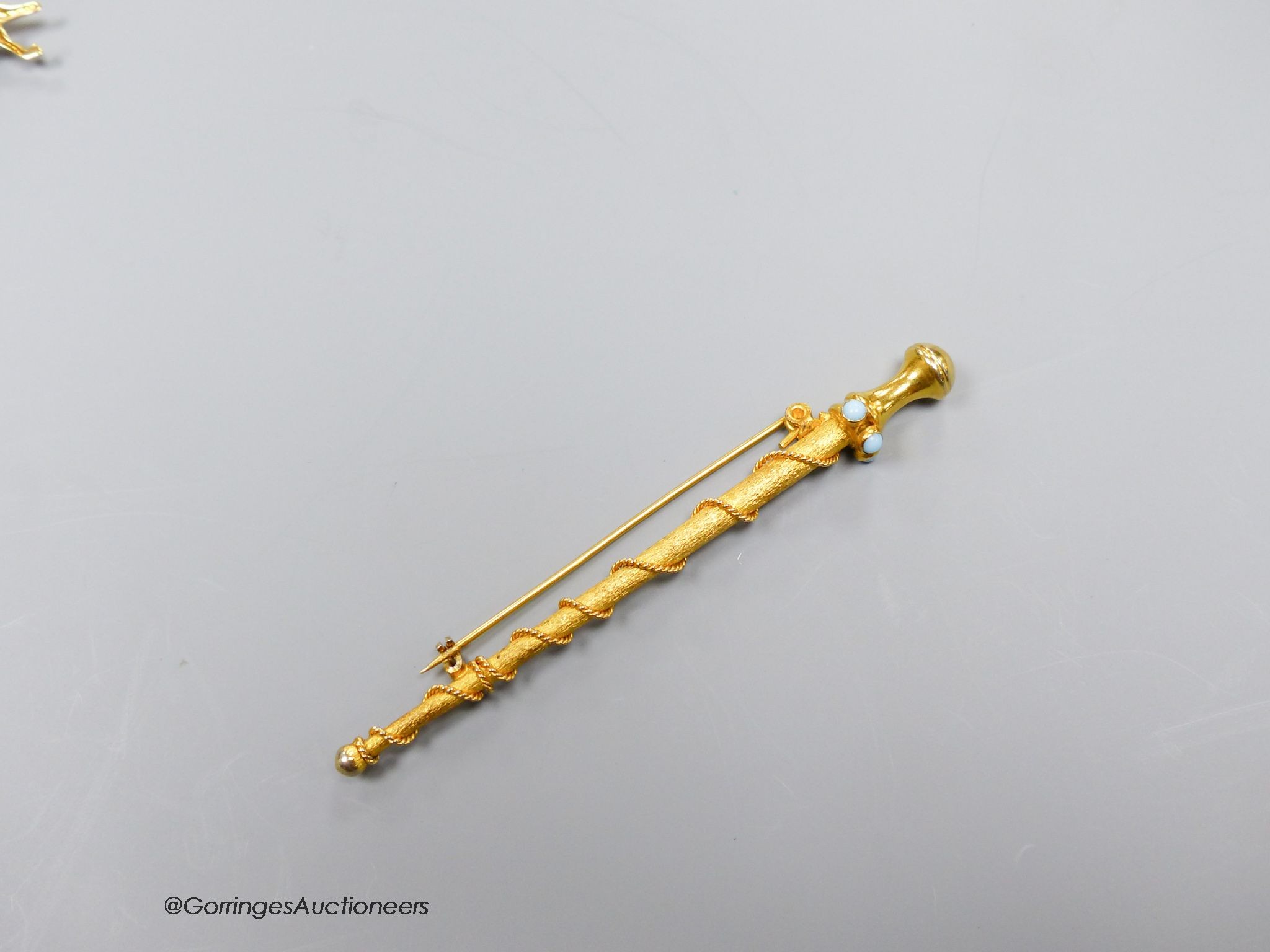 A gold turquoise set pin brooch, tests as 15ct, gross 10g, 9cm.